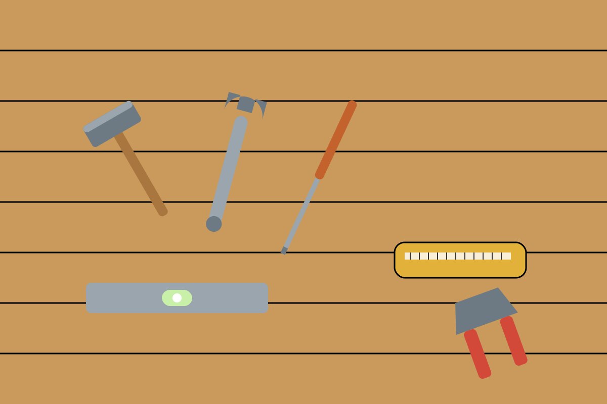 A set of basic hand tools laid out on a wooden surface