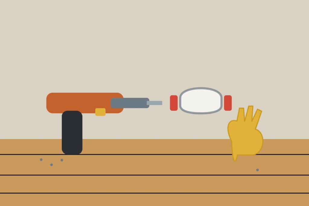 A cordless drill with safety goggles and gloves
