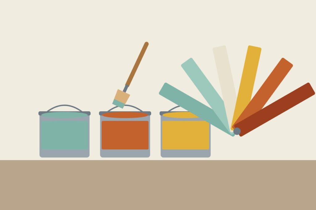 Paint cans, a brush, and a fan of colour swatches